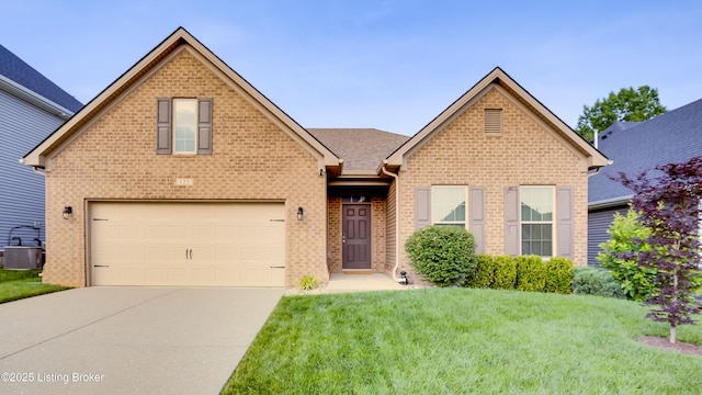 125 Belden Trl, Louisville, KY 40245 - view of front of property with concrete driveway, a front lawn, and brick siding