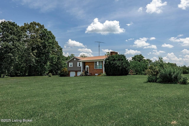 2149 Shrewsbury Rd, Leitchfield, KY 42754 - view of green lawn with an attached garage