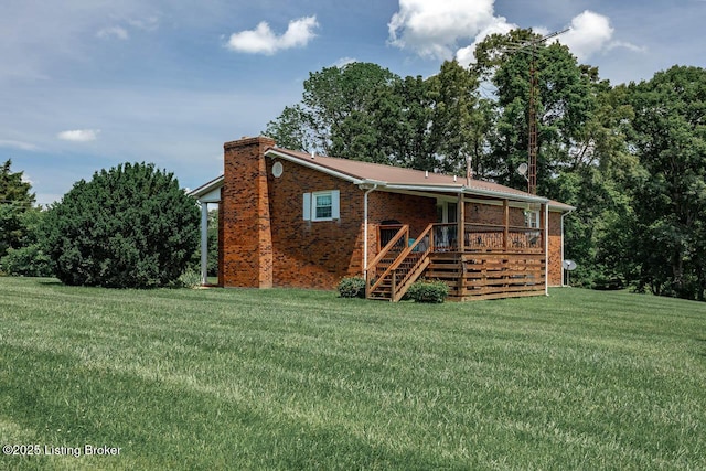 2149 Shrewsbury Rd, Leitchfield, KY 42754 - back of property featuring stairway, a chimney, brick siding, and a lawn