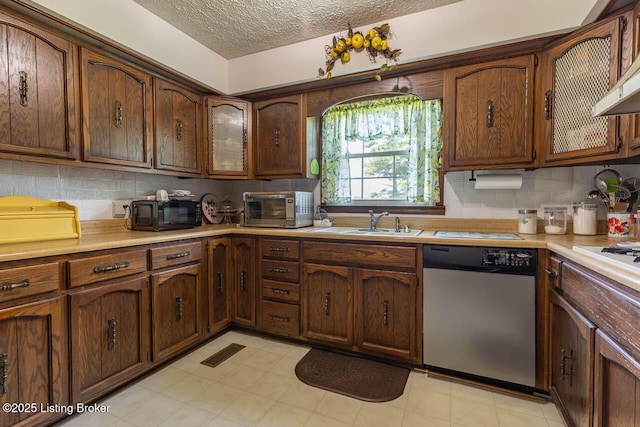 2149 Shrewsbury Rd, Leitchfield, KY 42754 - kitchen with stainless steel appliances, a textured ceiling, light countertops, decorative backsplash, and wall chimney exhaust hood