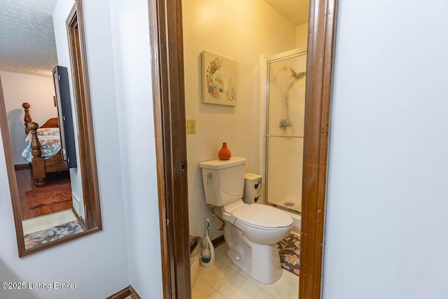 2149 Shrewsbury Rd, Leitchfield, KY 42754 - bathroom featuring a shower stall, a textured ceiling, and tile patterned flooring