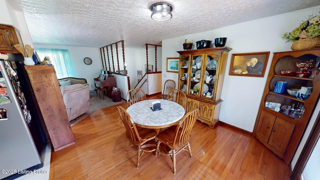 2149 Shrewsbury Rd, Leitchfield, KY 42754 - dining area with light wood finished floors and a textured ceiling