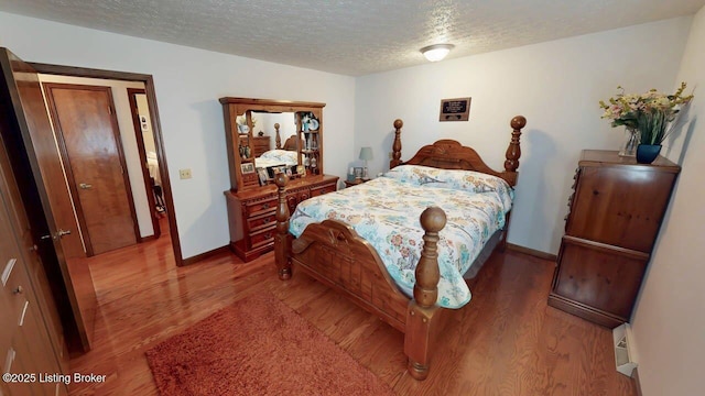 2149 Shrewsbury Rd, Leitchfield, KY 42754 - bedroom featuring wood finished floors and a textured ceiling