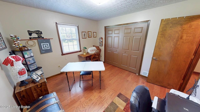 2149 Shrewsbury Rd, Leitchfield, KY 42754 - home office with light wood-style floors and a textured ceiling