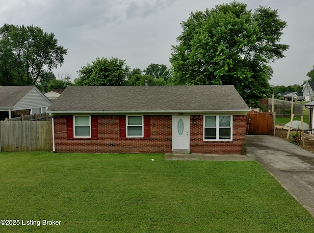 119 E Blue Jay Rd, Louisville, KY 40229 - view of front of house with brick siding, driveway, and a shingled roof