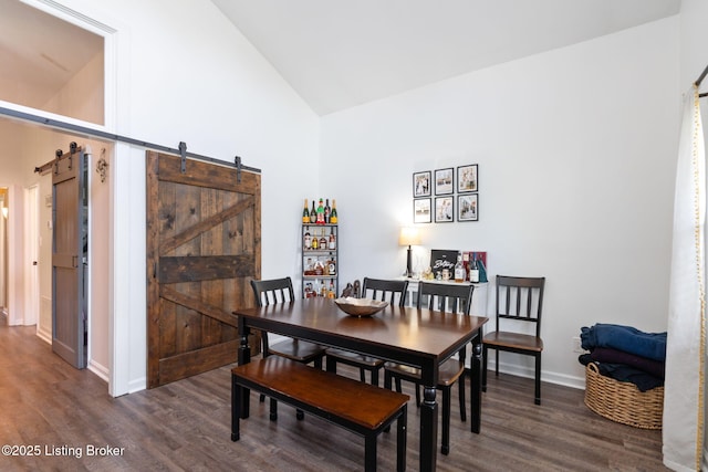 835 Forrest St, Louisville, KY 40217 - dining area with a barn door, wood finished floors, and high vaulted ceiling