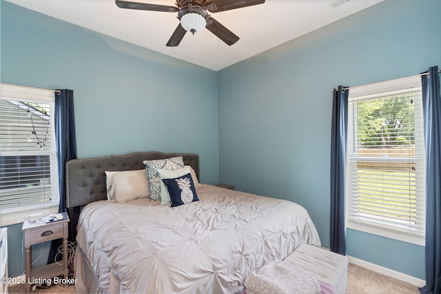 835 Forrest St, Louisville, KY 40217 - bedroom with vaulted ceiling, carpet, multiple windows, and a ceiling fan