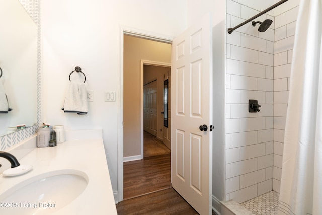 835 Forrest St, Louisville, KY 40217 - bathroom with a shower stall, wood finished floors, and vanity