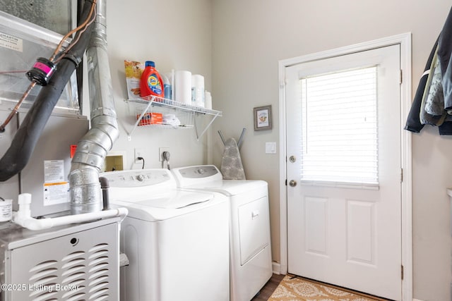 835 Forrest St, Louisville, KY 40217 - laundry area with washing machine and dryer, healthy amount of natural light, and wood finished floors