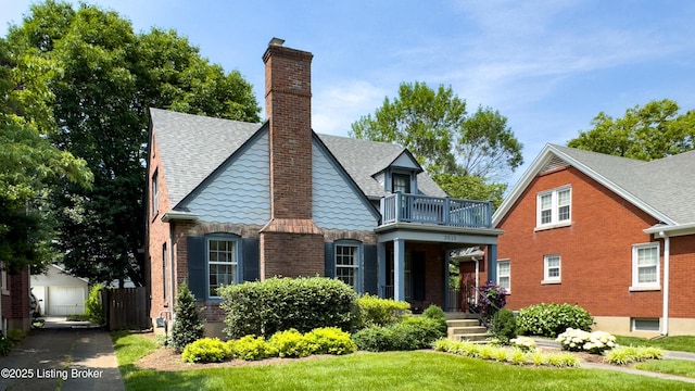 3615 Hycliffe Ave, Louisville, KY 40207 - view of front of home with a balcony, brick siding, roof with shingles, and a chimney