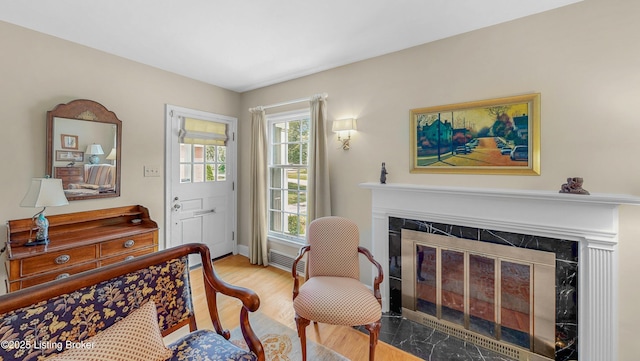 3615 Hycliffe Ave, Louisville, KY 40207 - sitting room with a tiled fireplace and wood finished floors
