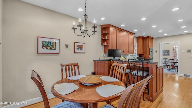 3615 Hycliffe Ave, Louisville, KY 40207 - dining room featuring light wood-style floors, recessed lighting, and a chandelier