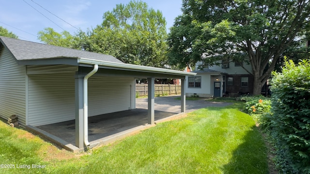 3615 Hycliffe Ave, Louisville, KY 40207 - view of side of property with a yard, an attached carport, and a shingled roof