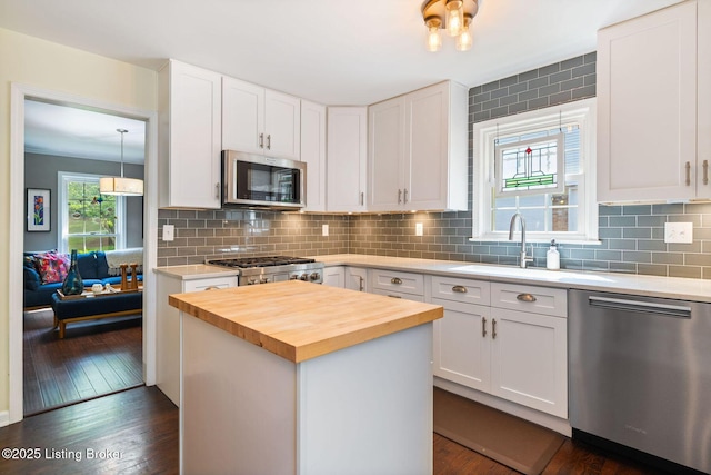 7104 Fox Harbor Rd, Prospect, KY 40059 - kitchen featuring appliances with stainless steel finishes, butcher block countertops, white cabinets, and dark wood-type flooring