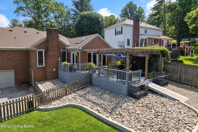 7104 Fox Harbor Rd, Prospect, KY 40059 - back of property with brick siding, a pergola, a fenced backyard, a chimney, and a wooden deck