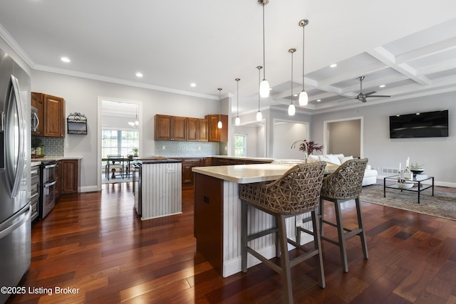 6103 Winkler Rd, Crestwood, KY 40014 - kitchen with a center island, appliances with stainless steel finishes, decorative backsplash, a breakfast bar, and recessed lighting
