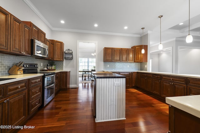 6103 Winkler Rd, Crestwood, KY 40014 - kitchen featuring appliances with stainless steel finishes, backsplash, a kitchen island, ornamental molding, and pendant lighting