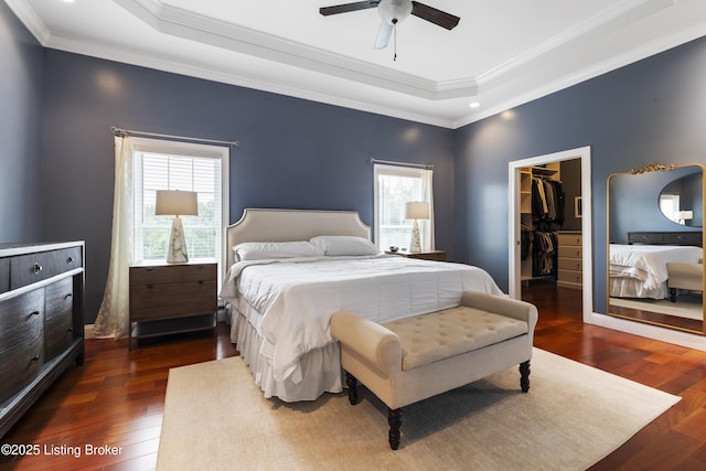 6103 Winkler Rd, Crestwood, KY 40014 - bedroom featuring a walk in closet, a tray ceiling, wood finished floors, ornamental molding, and recessed lighting