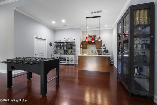 6103 Winkler Rd, Crestwood, KY 40014 - rec room featuring wet bar, dark wood-style floors, recessed lighting, and crown molding