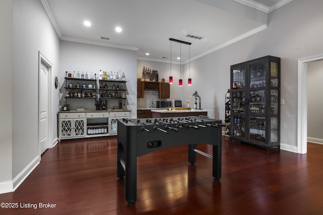 6103 Winkler Rd, Crestwood, KY 40014 - game room with bar, dark wood-style flooring, recessed lighting, and crown molding