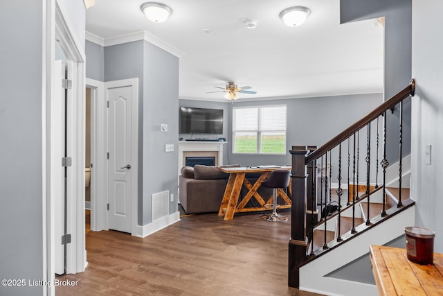 4066 Firestone Way, Shelbyville, KY 40065 - entrance foyer with a ceiling fan, crown molding, wood finished floors, a fireplace, and stairs