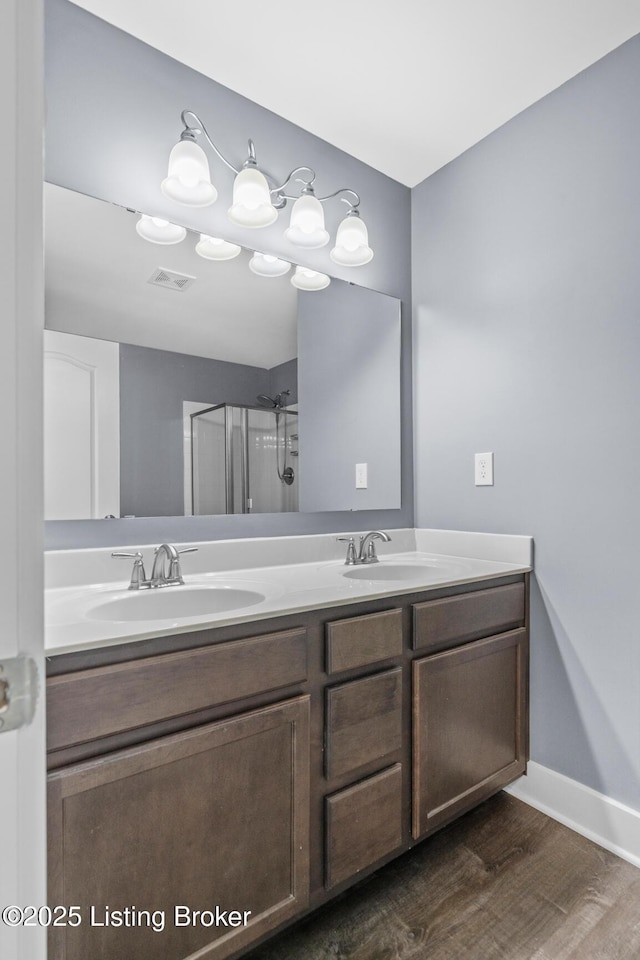 4066 Firestone Way, Shelbyville, KY 40065 - bathroom featuring double vanity, wood finished floors, and a shower