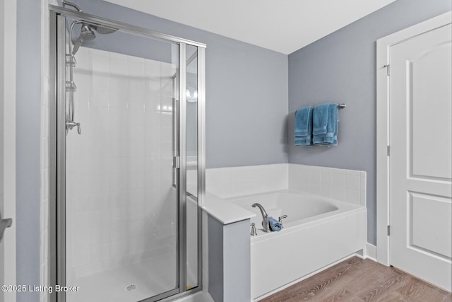 4066 Firestone Way, Shelbyville, KY 40065 - full bathroom featuring a stall shower, a garden tub, and wood finished floors