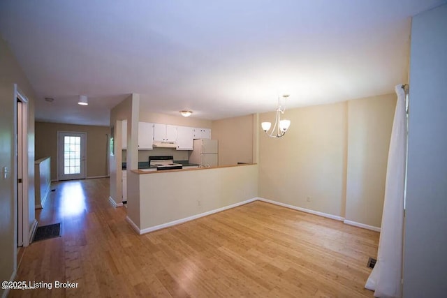 37 Lake Ave, Louisville, KY 40206 - kitchen featuring white appliances, light wood-type flooring, a chandelier, white cabinetry, and under cabinet range hood