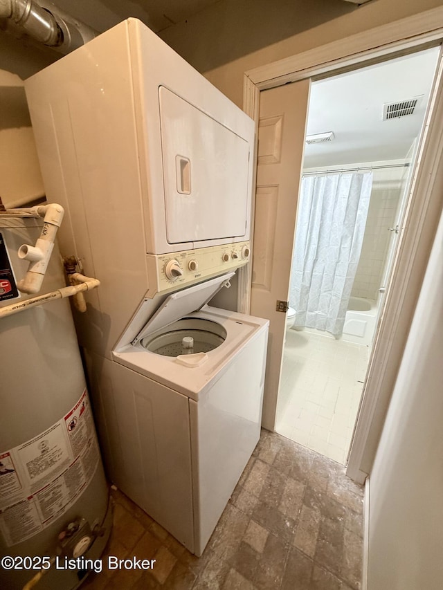 37 Lake Ave, Louisville, KY 40206 - laundry room featuring stacked washer / drying machine and water heater