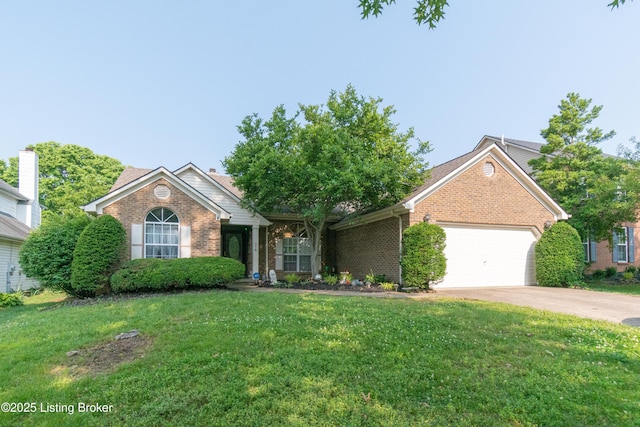 115 Canewood Blvd, Georgetown, KY 40324 - view of front of house with brick siding, a garage, a front yard, and driveway