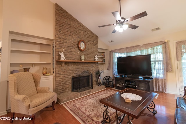 115 Canewood Blvd, Georgetown, KY 40324 - living area with built in features, lofted ceiling, wood finished floors, ceiling fan, and a fireplace
