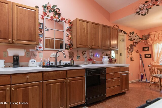 115 Canewood Blvd, Georgetown, KY 40324 - kitchen with black dishwasher, light countertops, light wood-type flooring, brown cabinets, and lofted ceiling