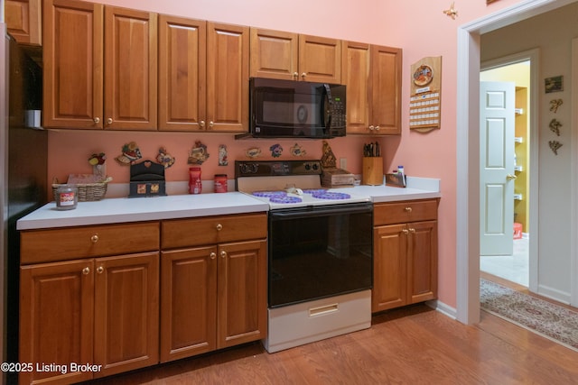 115 Canewood Blvd, Georgetown, KY 40324 - kitchen with black appliances, light countertops, and light wood-type flooring