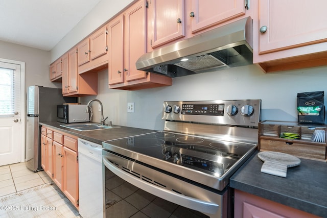10757 Colonial Woods Ct, Louisville, KY 40023 - kitchen featuring appliances with stainless steel finishes, range hood, light tile patterned floors, and dark countertops