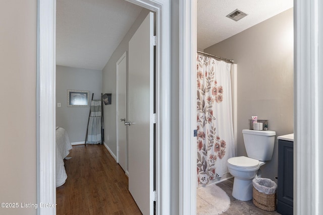 10757 Colonial Woods Ct, Louisville, KY 40023 - bathroom with vanity, wood finished floors, and a shower with shower curtain