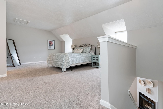 10757 Colonial Woods Ct, Louisville, KY 40023 - bedroom with carpet floors, lofted ceiling, a textured ceiling, and a fireplace