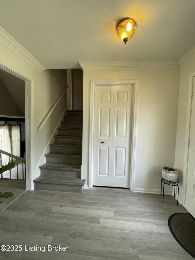 402 Bromwell Dr, Louisville, KY 40245 - staircase with wood finished floors and ornamental molding