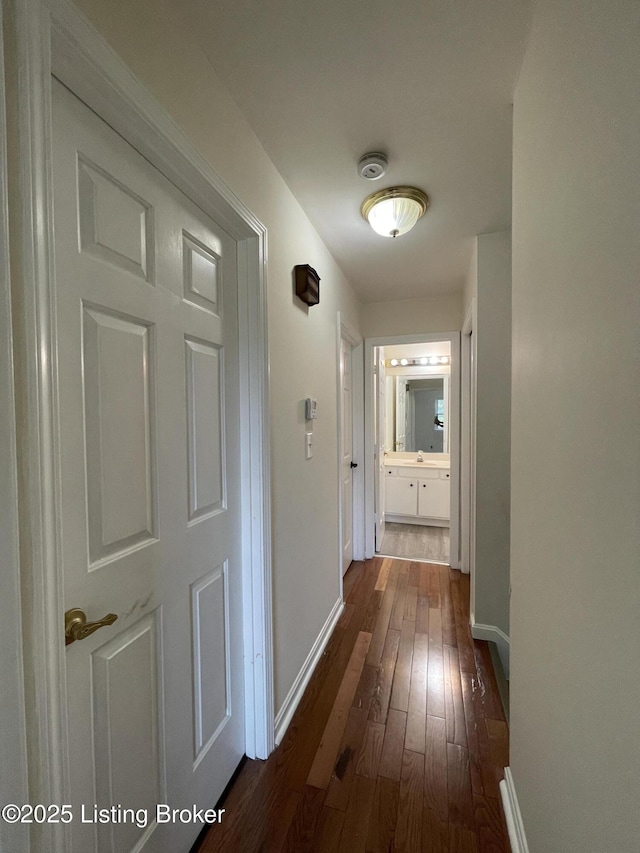 402 Bromwell Dr, Louisville, KY 40245 - hallway featuring dark wood finished floors and baseboards