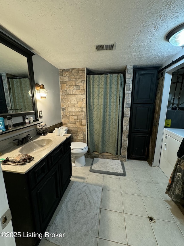 343 Navaho Rd, Brandenburg, KY 40108 - full bathroom with vanity, washer / dryer, a textured ceiling, curtained shower, and tile patterned floors