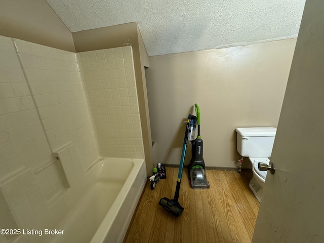 343 Navaho Rd, Brandenburg, KY 40108 - full bath with wood finished floors, a textured ceiling, and shower / tub combination