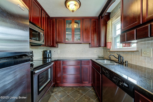 11208 Hasbrook Ct, Louisville, KY 40229 - kitchen featuring stainless steel appliances, reddish brown cabinets, and tasteful backsplash