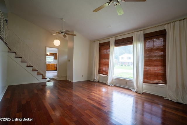 7906 Brynwood Ct, Louisville, KY 40291 - empty room with a ceiling fan, vaulted ceiling, wood finished floors, and stairs
