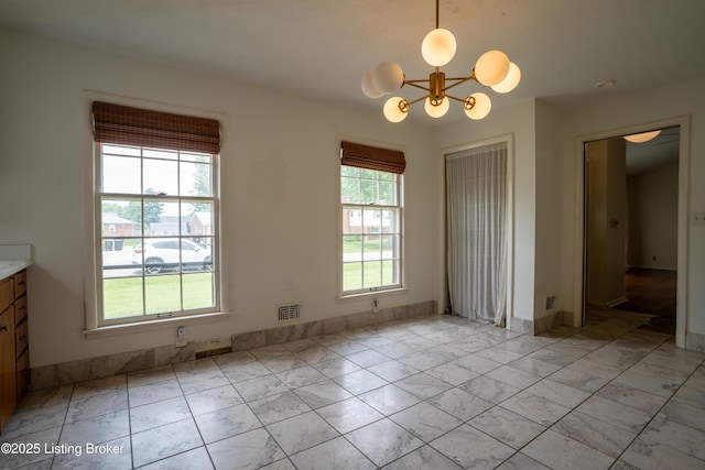 7906 Brynwood Ct, Louisville, KY 40291 - unfurnished dining area with a chandelier and light marble finish flooring