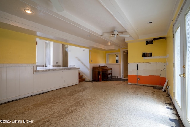 7906 Brynwood Ct, Louisville, KY 40291 - unfurnished living room featuring a ceiling fan, healthy amount of natural light, beamed ceiling, stairs, and recessed lighting