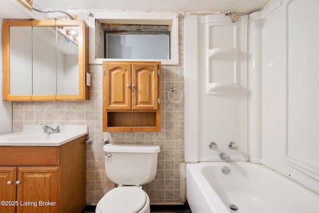 1833 Farnsley Rd, Louisville, KY 40216 - bathroom featuring tile walls, vanity, and bathing tub / shower combination