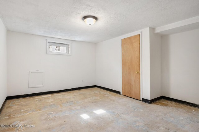 1833 Farnsley Rd, Louisville, KY 40216 - empty room with baseboards and a textured ceiling