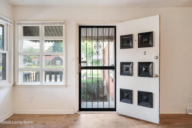 1833 Farnsley Rd, Louisville, KY 40216 - doorway to outside with wood finished floors and baseboards