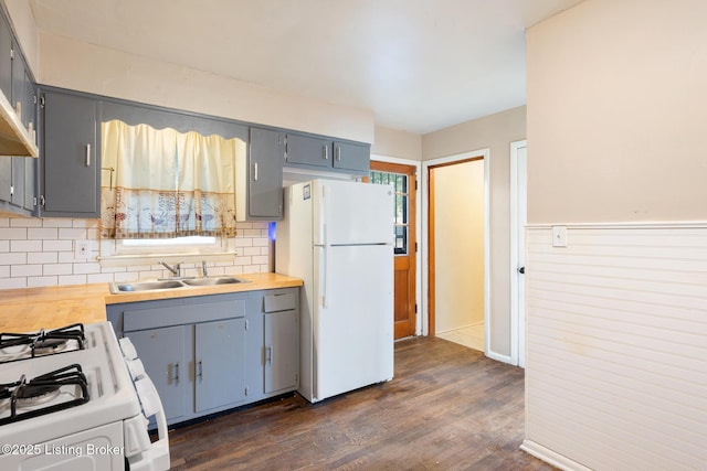 1833 Farnsley Rd, Louisville, KY 40216 - kitchen featuring white appliances, gray cabinetry, dark wood-style floors, backsplash, and a wainscoted wall