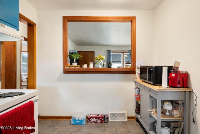 1833 Farnsley Rd, Louisville, KY 40216 - kitchen featuring electric stove, black microwave, and exhaust hood