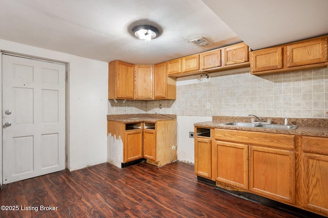 1833 Farnsley Rd, Louisville, KY 40216 - kitchen featuring dark wood finished floors, decorative backsplash, and light countertops